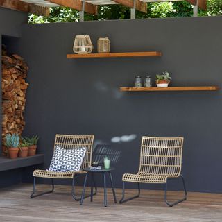 bamboo stacking chair on wooden flooring and grey wall