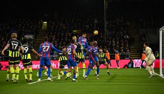 Crystal Palace's French defender #05 Maxence Lacroix (C) heads the ball and scores his team second goal during the English Premier League football match between Crystal Palace and Manchester City at Selhurst Park in south London on December 7, 2024.