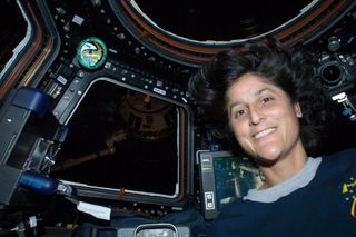 NASA astronaut Sunita Williams, Expedition 32 flight engineer, is pictured in the Cupola of the International Space Station during rendezvous operations with the unpiloted Japan Aerospace Exploration Agency (JAXA) H-II Transfer Vehicle (HTV-3). This image was taken July 27, 2012.