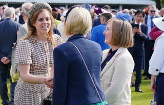 Princess Beatrice of York speaks to guests at a Royal Garden Party at Buckingham Palace