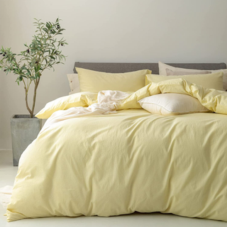 A pastel yellow bedding set