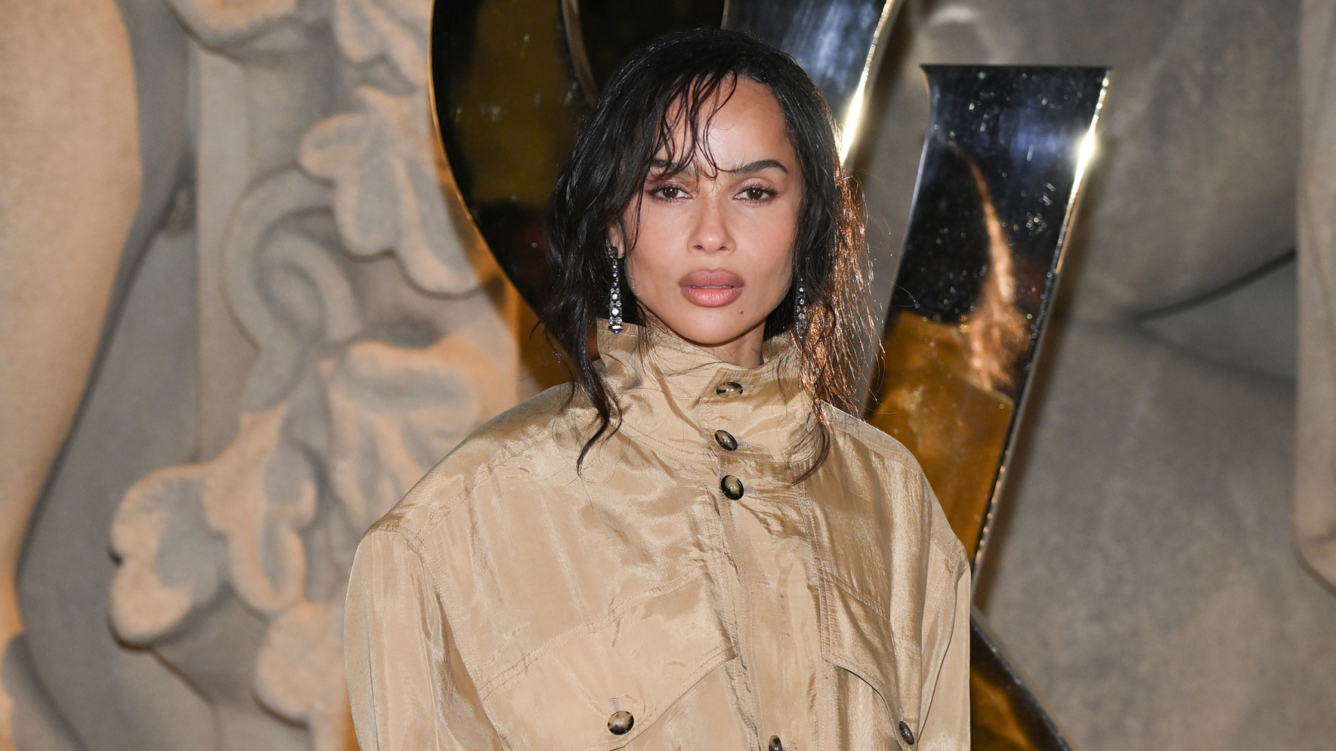 Zoë Kravitz in Paris wearing a button up jacket with jessica mccormack earrings