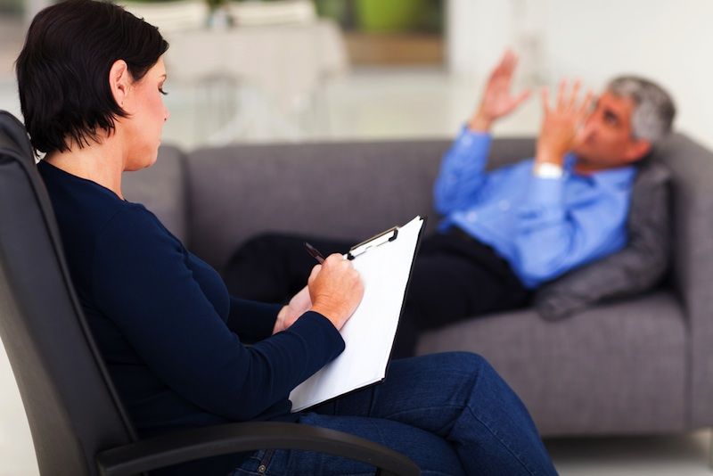 psychiatrist and patient on couch