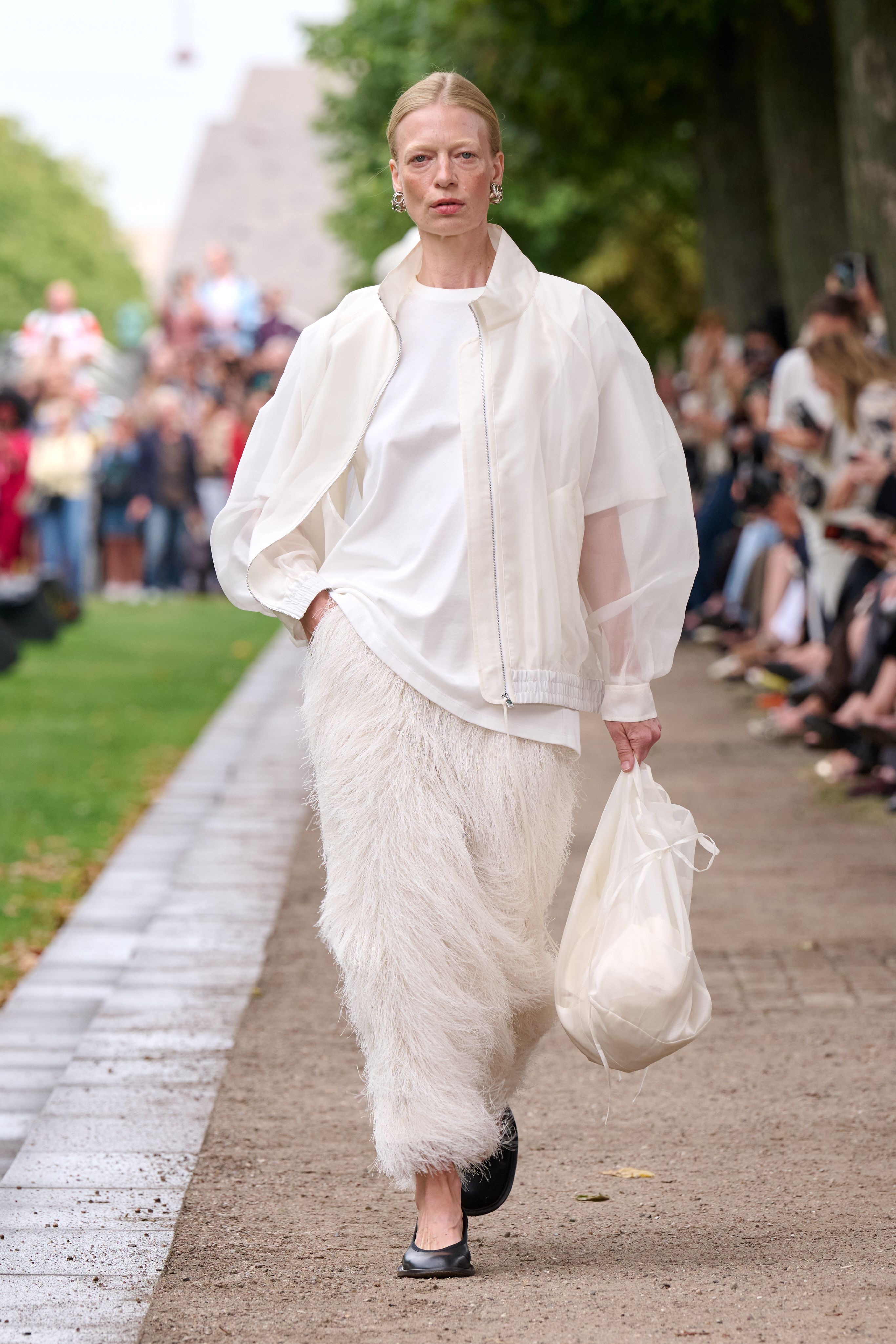 Spring 2027 Copenhagen Fashion Week looks featuring fringe and textured details in neutral tailoring from The Garment, Mr Larkin, MKDT Studio, and By Malene Birger.