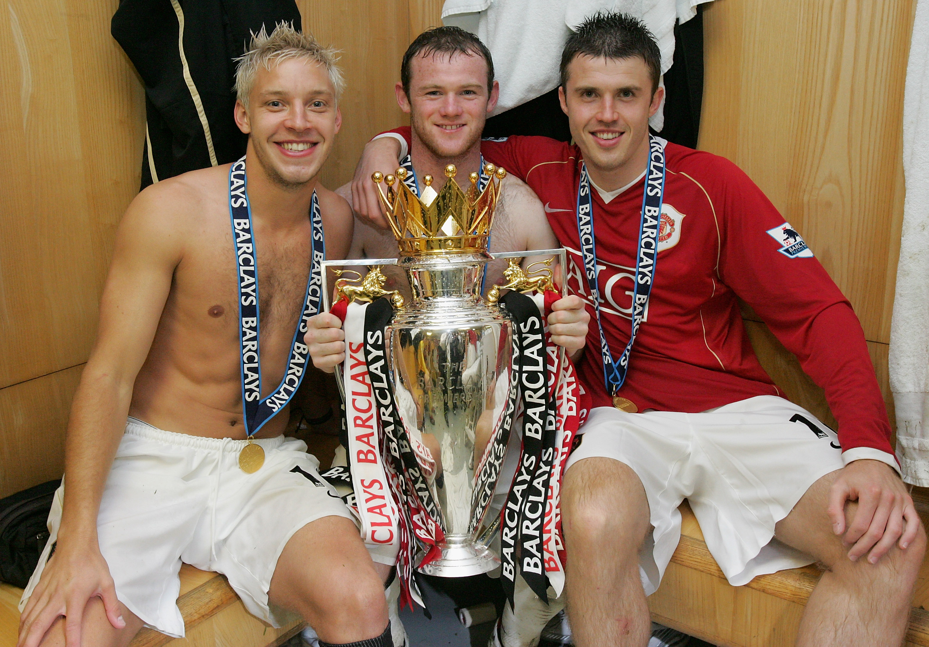 MANCHESTER, ENGLAND - MAY 13: Alan Smith, Wayne Rooney and Michael Carrick of Manchester United celebrate winning the Barclays Premiership in the dressing room after the Barclays Premiership match between Manchester United and West Ham at Old Trafford on May 13 2007 in Manchester, England. (Photo by John Peters/Manchester United via Getty Images) *** Local Caption *** Alan Smith;Wayne Rooney;Michael Carrick