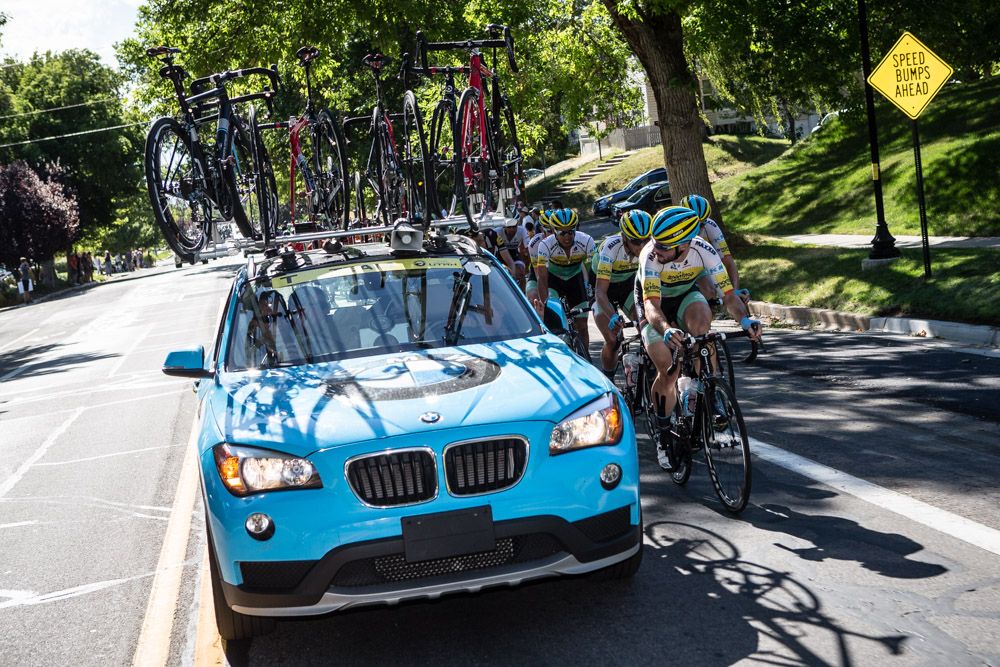 The SmartStop team car moves up to the team to give direction