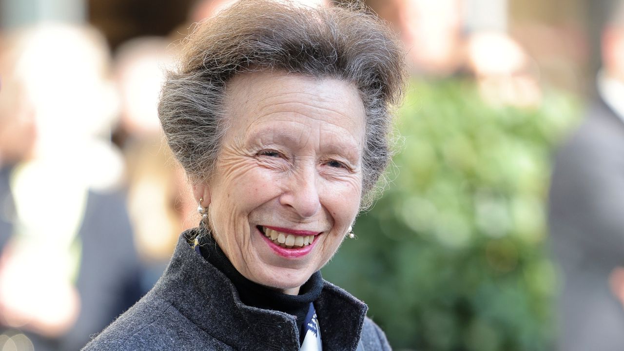 Princess Anne, Princess Royal holds a gifted scarf made from St James Quarter tartan, designed by Edinburgh College of Art graduate Rosie Baird during a VIP tour of St James Quarter on September 29, 2022 in Edinburgh, Scotland. 