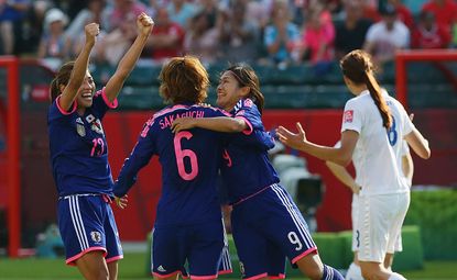 Japan celebrates its win in the semi-final of the Women's World Cup.