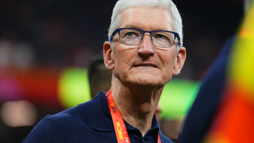 Tim Cook appears on the field at a Super Bowl game