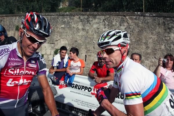 Cadel Evans congratulates teammate Gilbert on his victory.