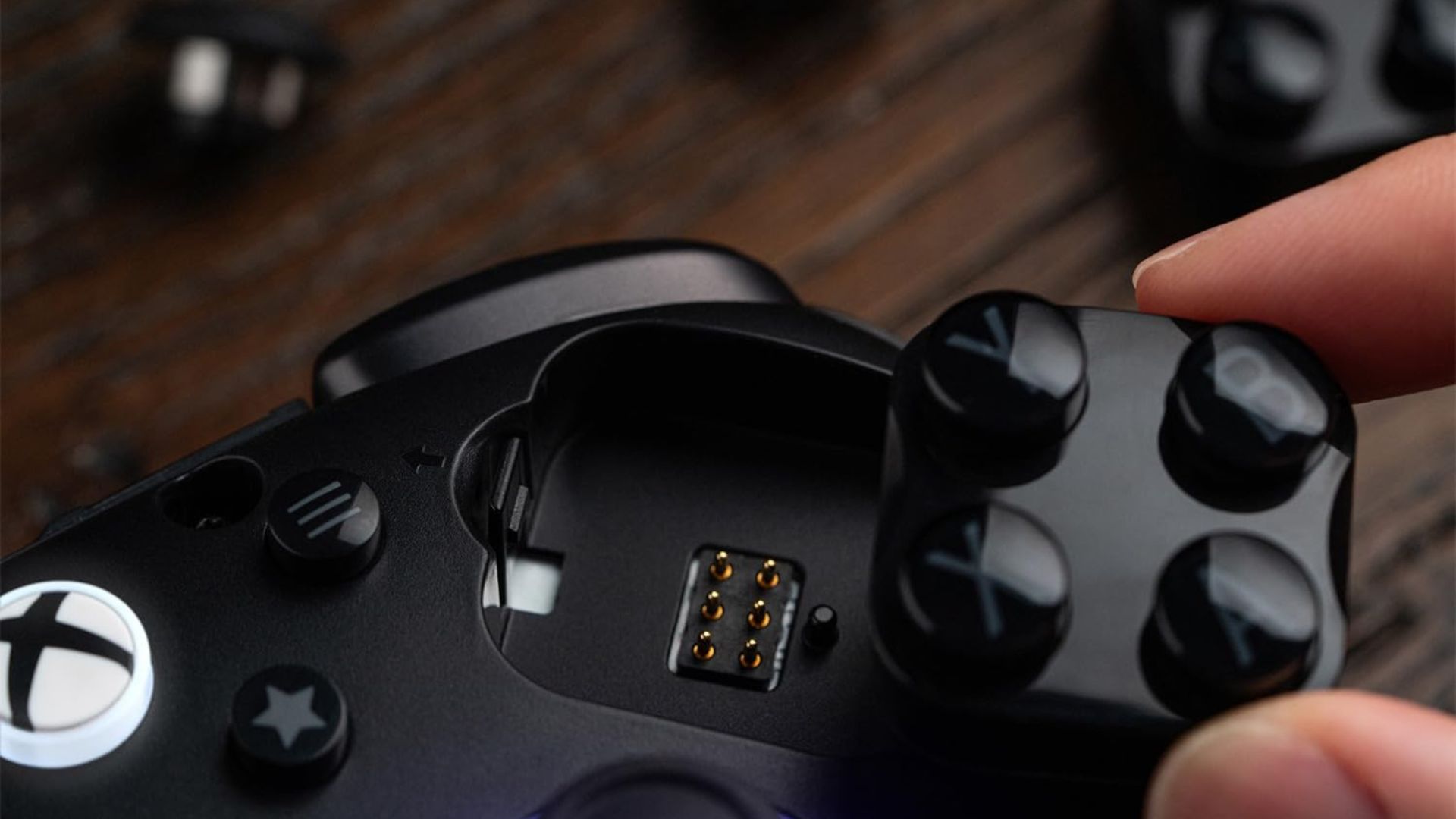 A close up image of the swappable face button module on the 8BitDo Ultimate 3E