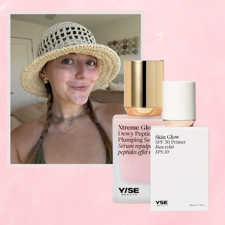 girl in pigtail braids and a sun hat with a summer glow next to yise beauty skincare bottles on a pink background