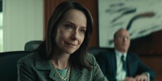 Amy Ryan listens patiently with Michael Keaton in the background in Worth.