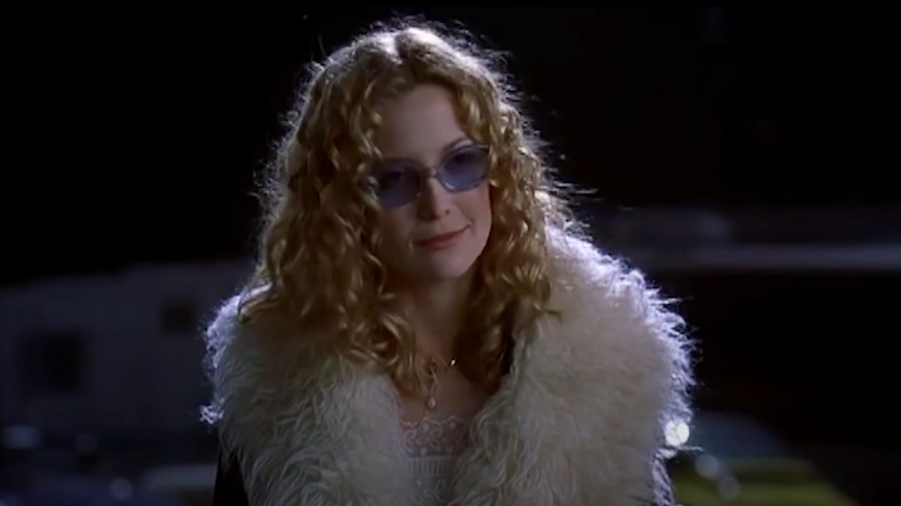 Kate Hudson as Penny Lane in a fur coat and blue sunglasses in Almost Famous.