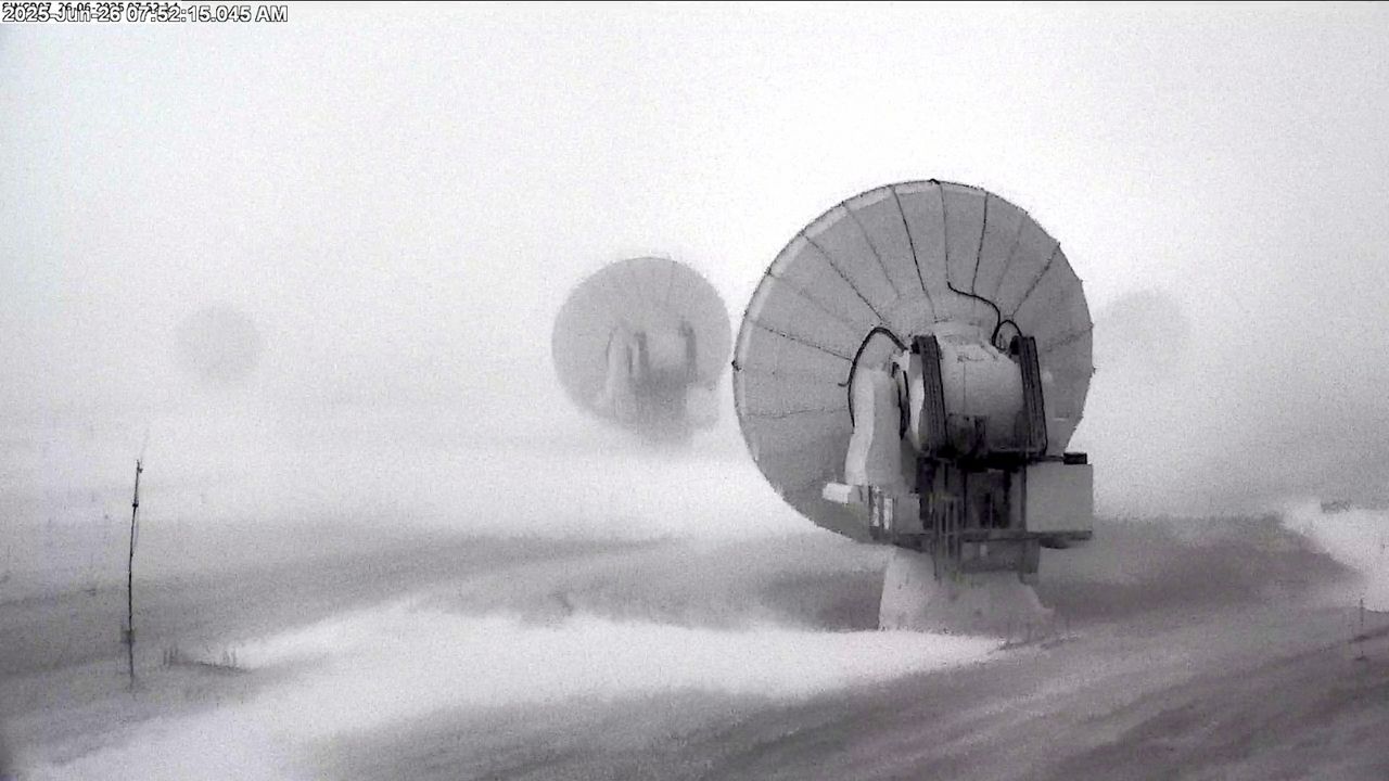 a grainy image of satellite arrays with snow on the ground