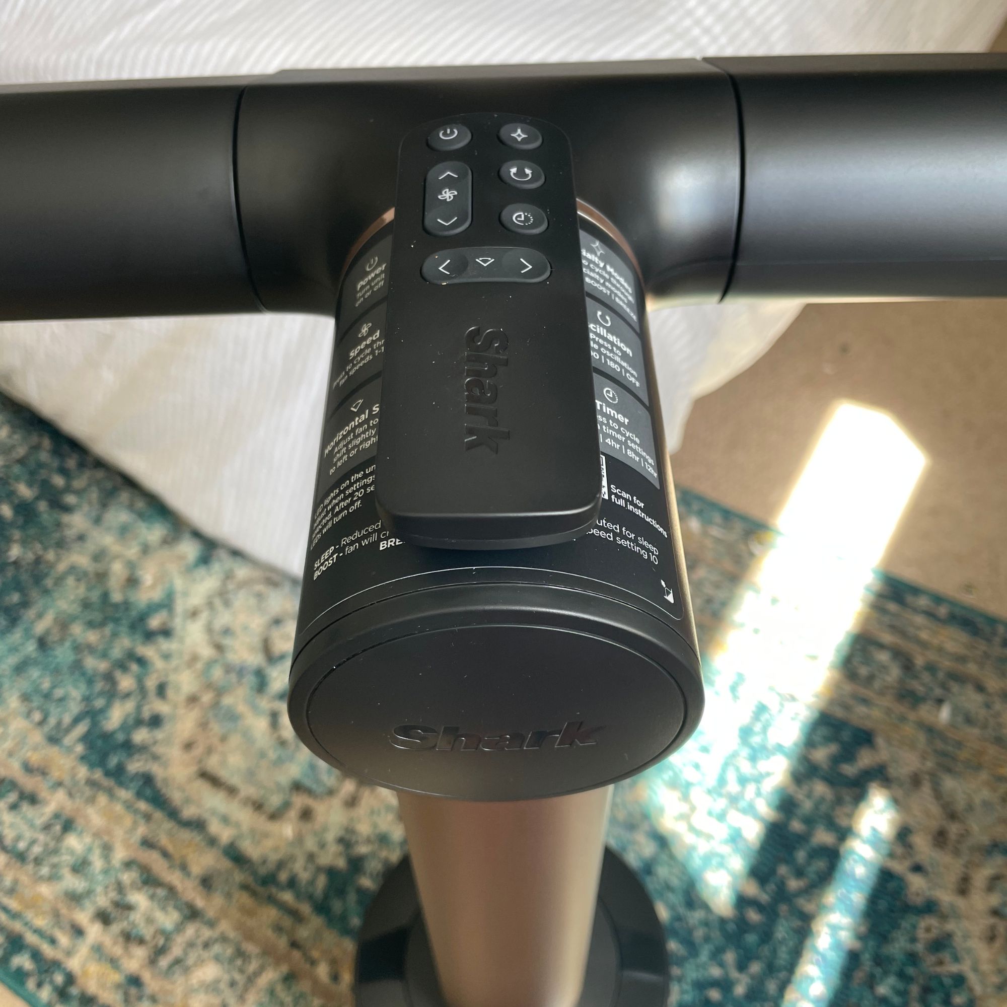 The top of the Shark TurboBlade fan, with the remote control sitting on it