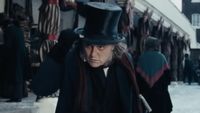 Johnny Depp as Ebenezer Scrooge tipping his hat in Ebenezer. 