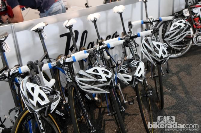 Helmets are washed after training rides and race stages, then hung back on a rider's bike before the next day's outing.