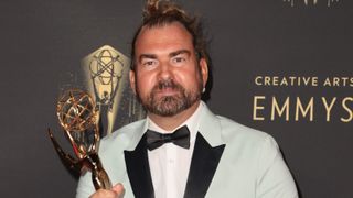 Marc Pilcher poses with the award for Outstanding Period And/Or Character Hairstyling for "Bridgerton" at Microsoft Theater on September 11, 2021 in Los Angeles, California.