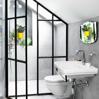 attic bathroom with white basin and yellow vase