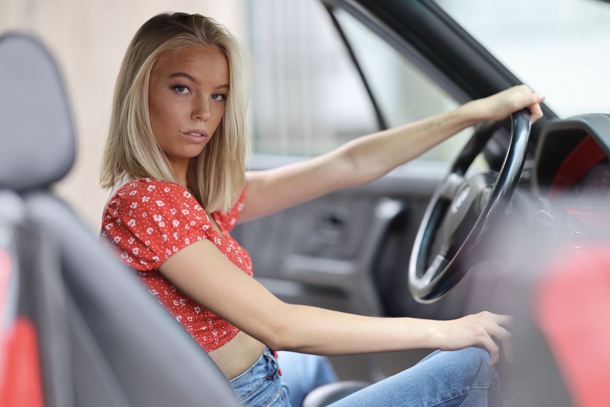 Portrait of woman sitting in car