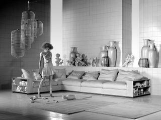 Archive Flexform photography: woman playing golf beside sofa
