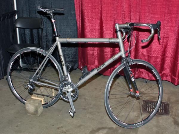 Lennard Zinn's personal titanium travel bike is so big that it requires an extra pair of S&amp;S couplings to get the pieces small enough to fit in the storage case.