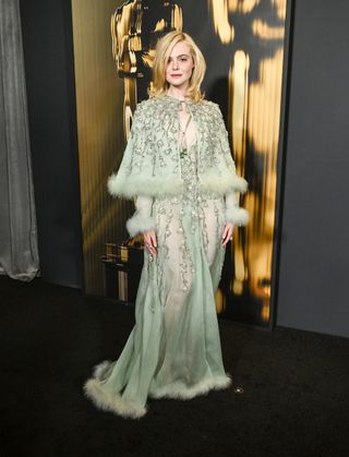 Elle Fanning wears a pistachio green gown