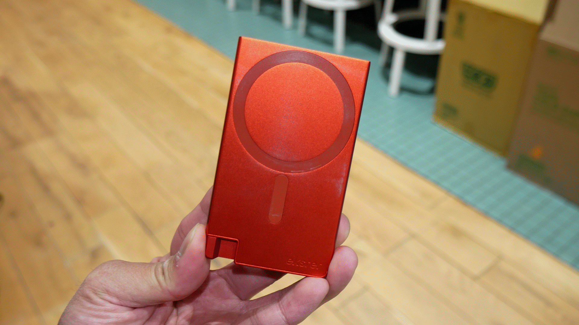 Ekster Cardholder Pro for MagSafe dealing out cards.