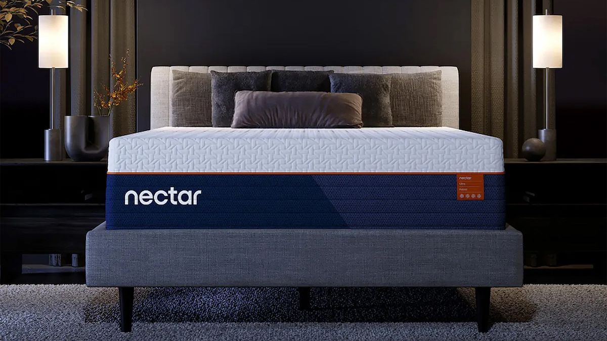 The Nectar Ultra Hybrid Mattress on a bed frame in a luxurious looking bedroom