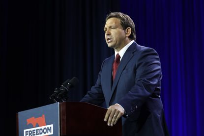 Ron DeSantis at a podium