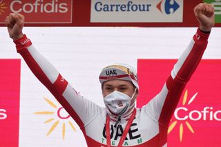 UAE Emirates Teams Belgian rider Jasper Philipsen celebrates on the podium after winning the 15th stage of the 2020 La Vuelta cycling tour of Spain a 2308km race from Mos to Puebla de Sanabria on November 5 2020 Photo by MIGUEL RIOPA AFP Photo by MIGUEL RIOPAAFP via Getty Images