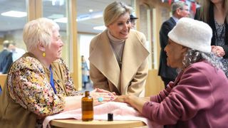 Sophie, Duchess of Edinburgh smiles as she speaks with members of the open house community group for over 65s at the Rising Brook Community Church