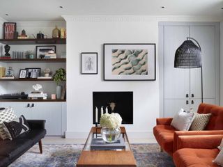 A living room using asymmetry in artwork