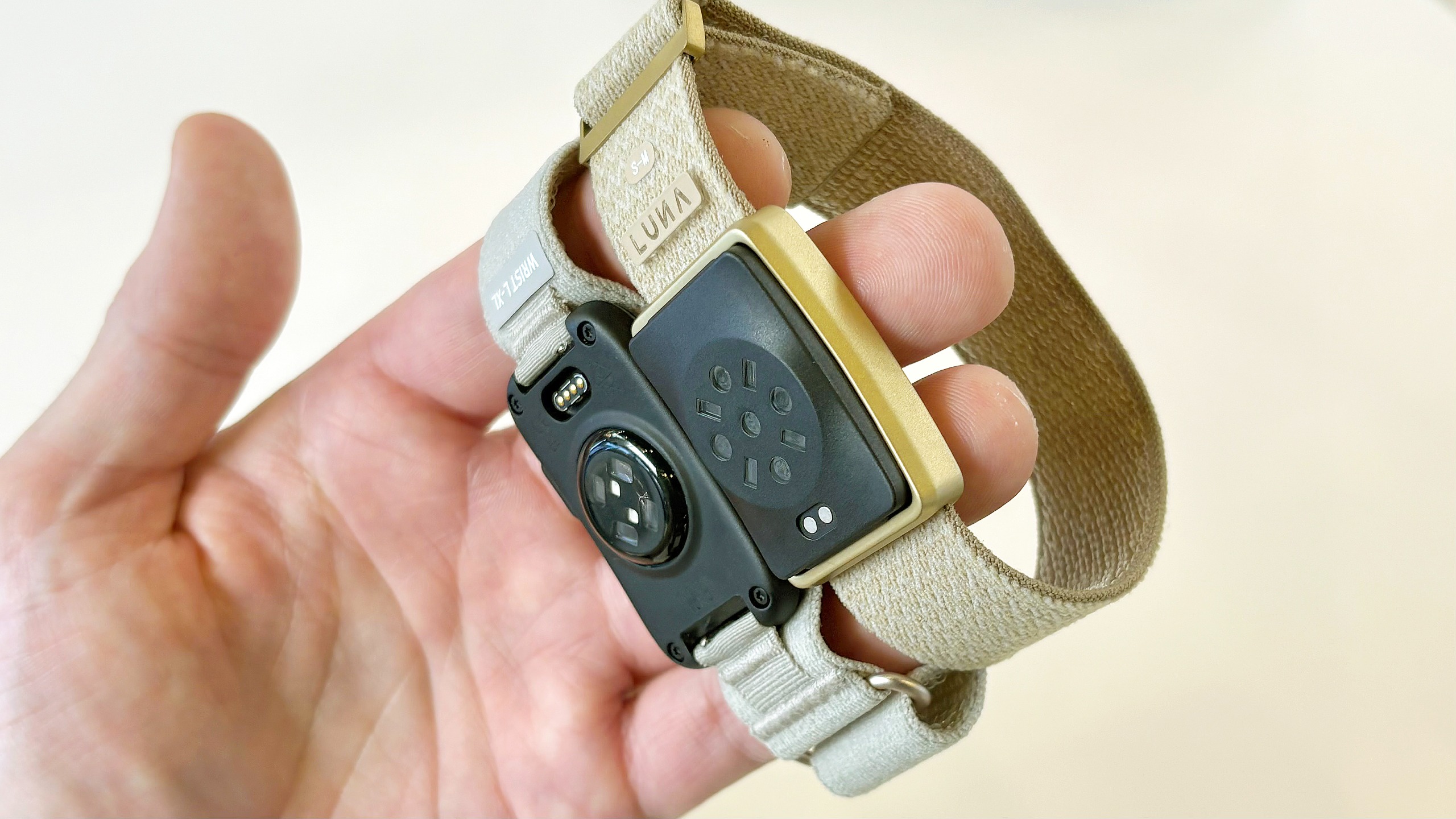 Close-up of the Garmin Cirqa screen-free tracker next to the Luna Band at IFA 2026 in Berlin