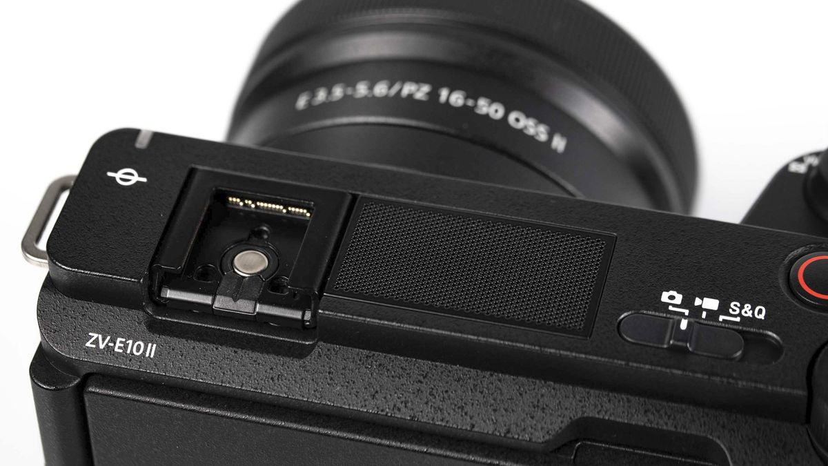 Sony ZV-E10 II on reflective surface and white background