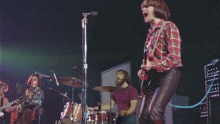 Creedence Clearwater Revival perform onstage at the Royal Albert Hall in 1970, a legendary performance that is being released as a live album and a documentary
