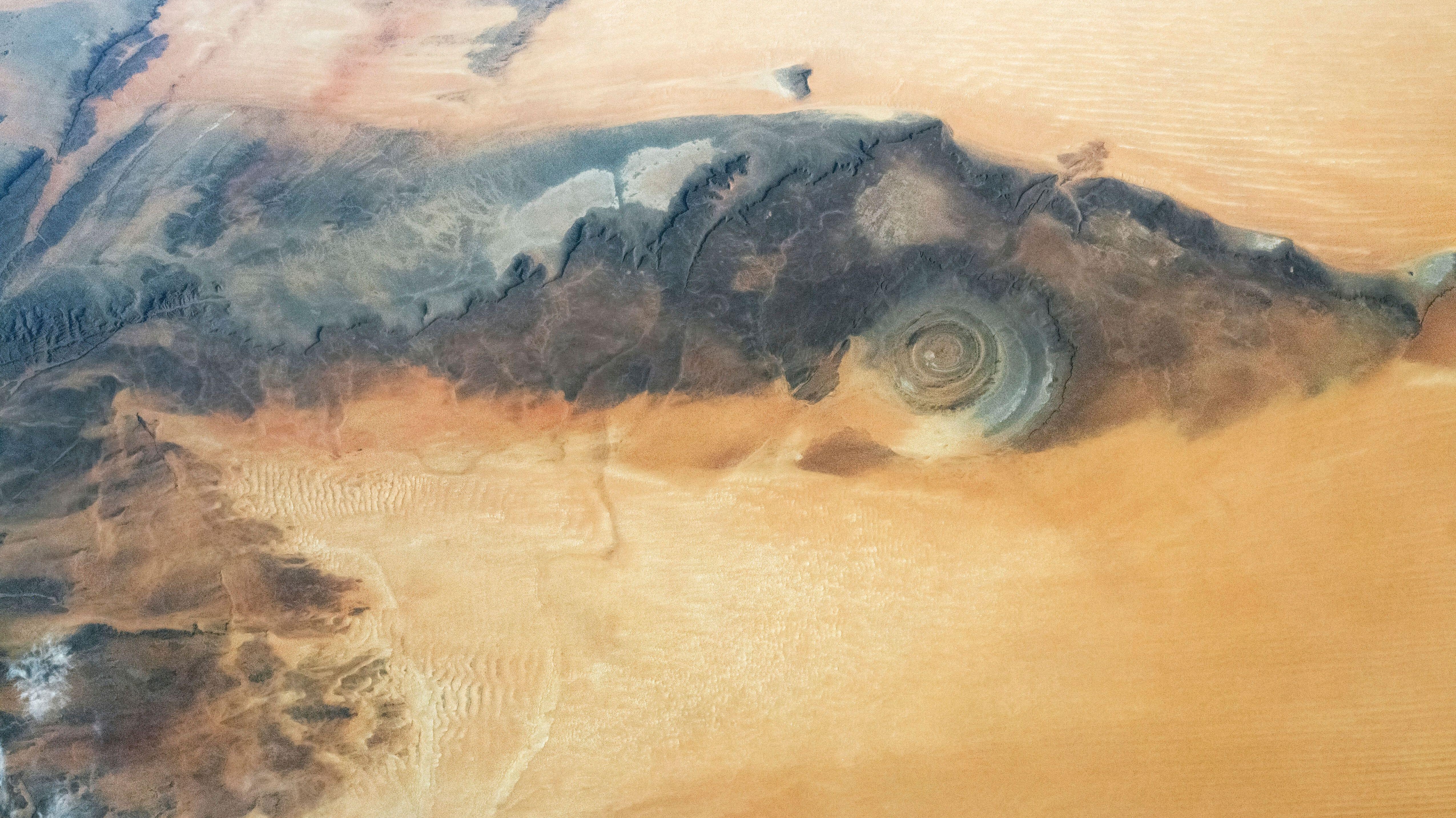 A view from space of the Rishaat structures showing the surrounding sand dunes.