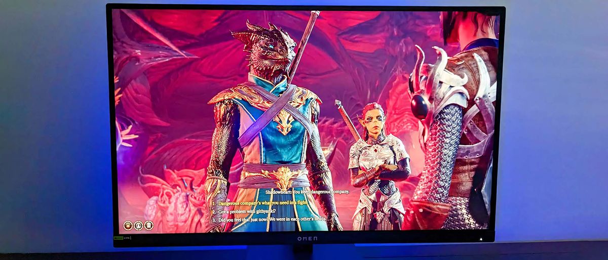 HP OMEN 27k with Baldur&#039;s Gate 3 on display and blue lighting.