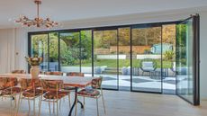 IDSystems kitchen with dining table, light fixture and Vistaline glazed windows - one of the four window glazing options