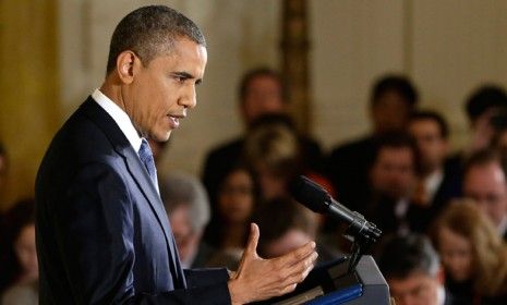 President Barack Obama answers questions at a news conference in the East Room of the White House on Nov. 14.