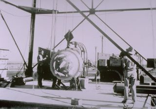 Researchers prepare the 'Gadget' for detonation in America's first nuclear bomb test.