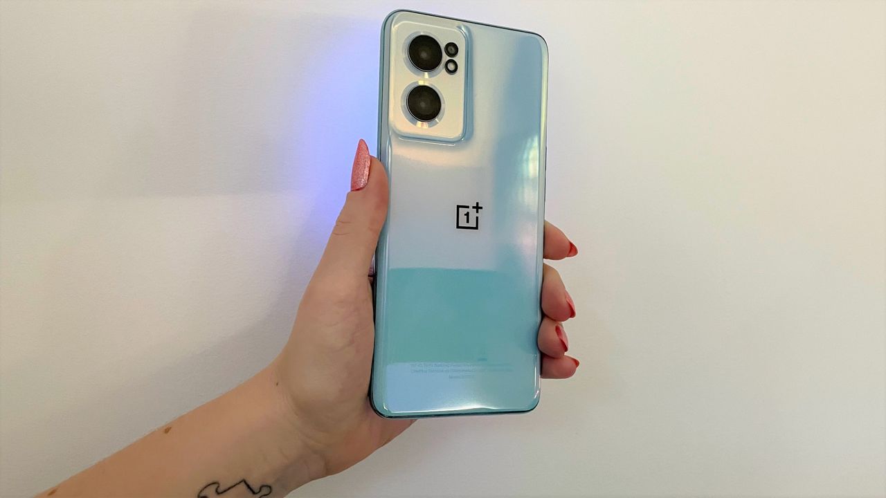 OnePlus Nord CE 2 review: holding the phone against a white wall