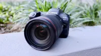 The Canon EOS R5, one of the best mirrorless cameras you can buy, resting on grey stone