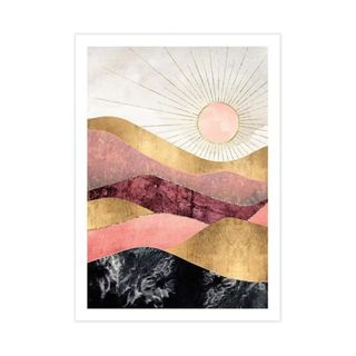 A wall art print with a sun setting over gold, purple, and black waves