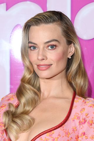 Margot Robbie attends a photocall on July 13, 2023 in London, England.