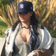 Rihanna was spotted wearing an animal-print fur coat and pajama-inspired pants