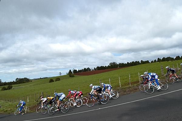 Riders descend around a corner on the 12km circuit in West Mooreville on the outskirts of Burnie during stage six.