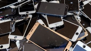 A pile of discarded smartphones