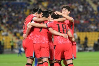 Son Heung-min (second left) celebrates with his South Korea team-mates after scoring against Thailand in March 2024.